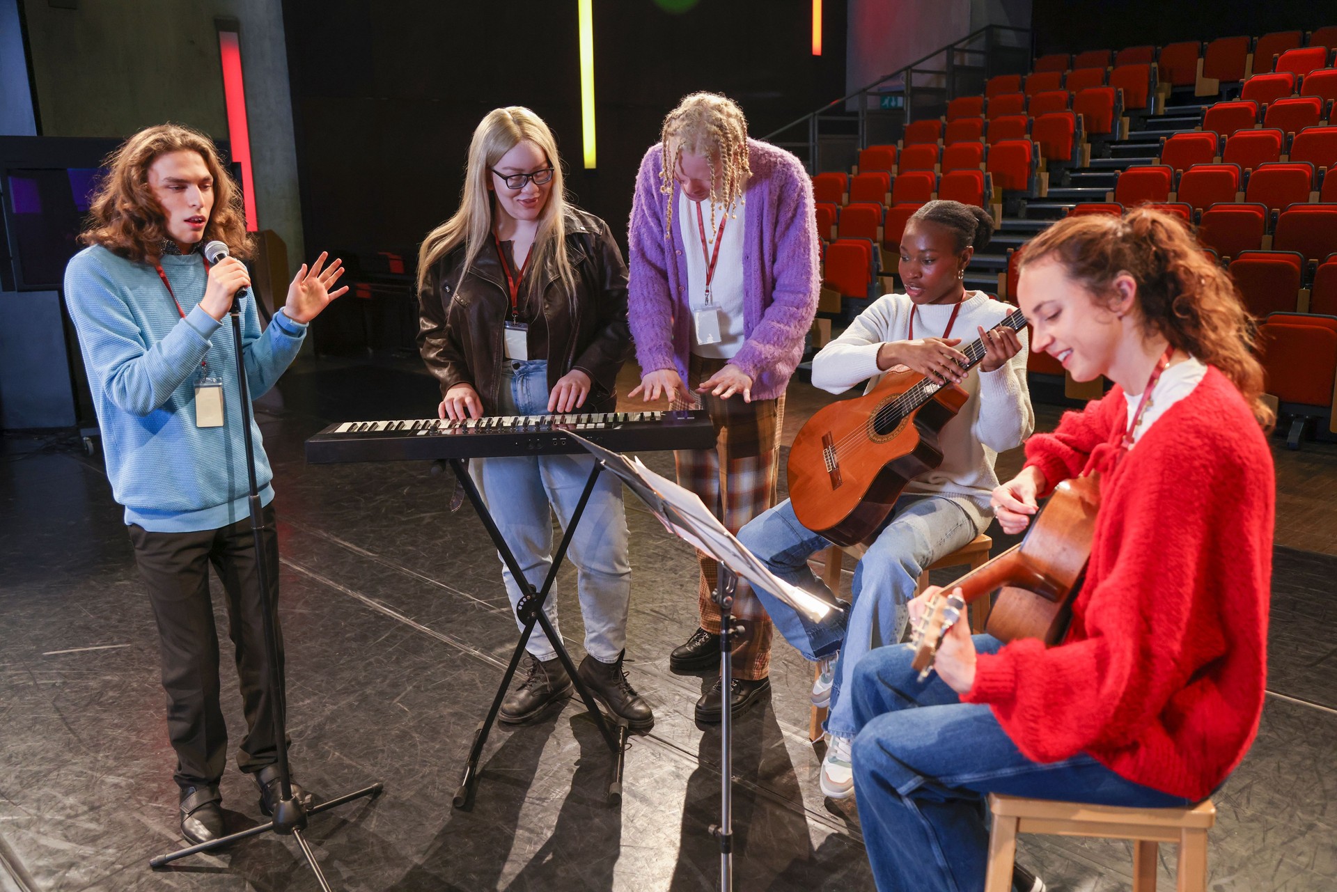 Friends playing and singing during rehearsal